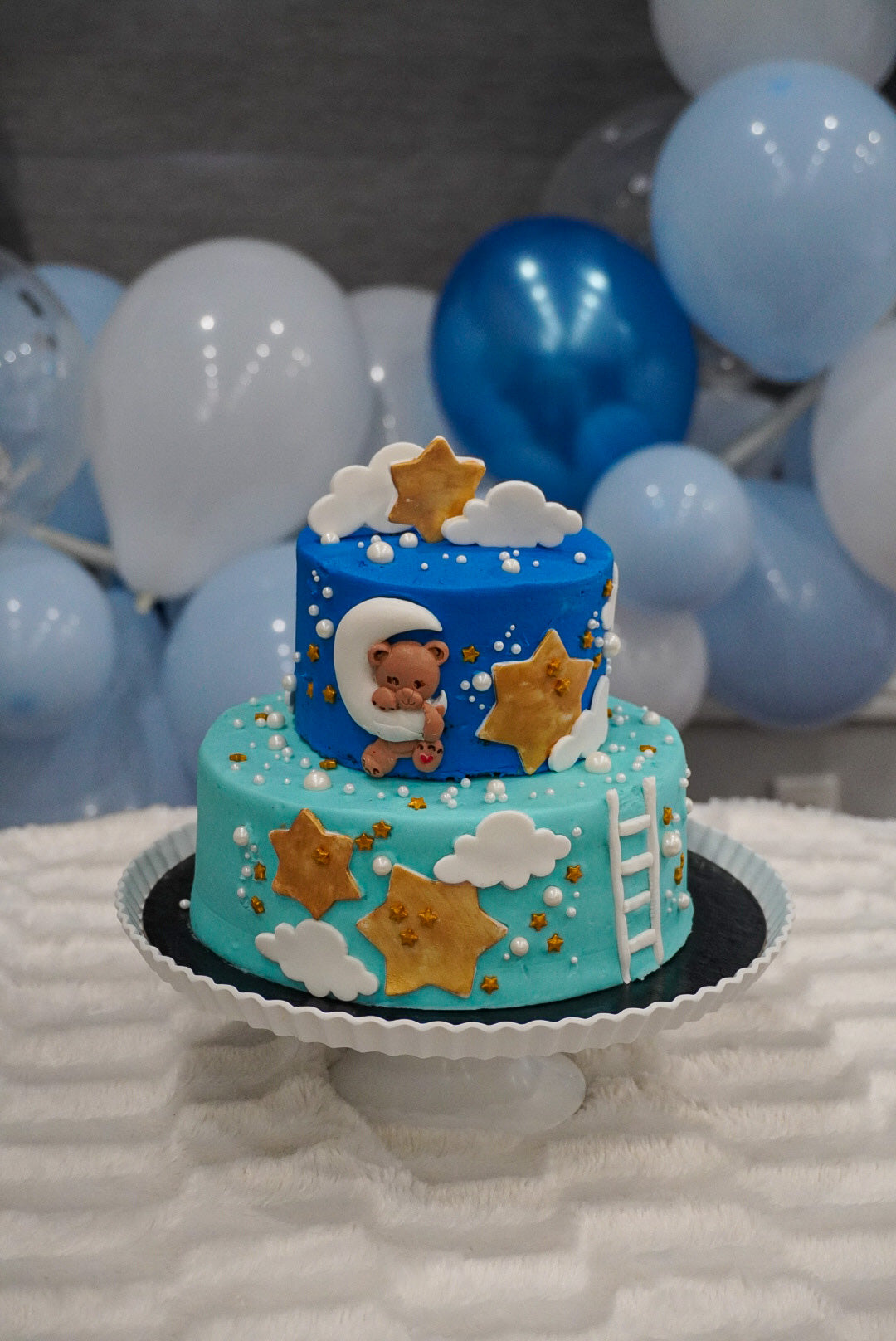 Elegant handcrafted baby shower cake with personalized decoration — made to order in Mississauga