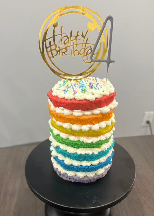 Vibrant rainbow layer cake with colourful hidden sponge layers — custom birthday cake delivery Mississauga