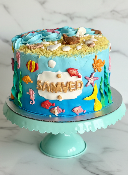 Custom Water Kingdom ocean theme birthday cake with sea creatures and waves — handmade cake delivery Mississauga Brampton